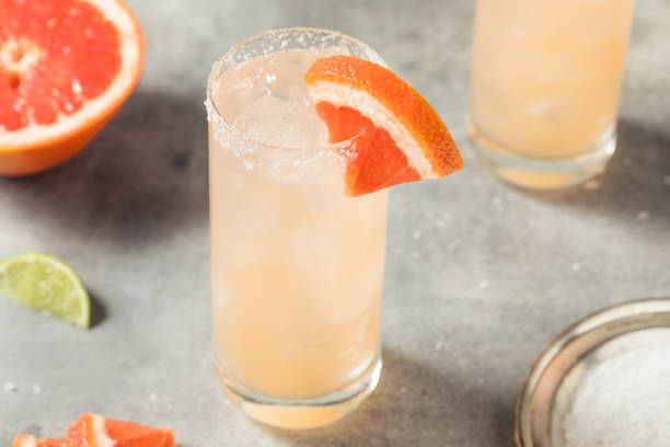 Cold Refreshing Tequila Paloma Cocktail Cold Refreshing Tequila Paloma Cocktail with Grapefruit and Salt Paloma stock pictures, royalty-free photos & images
