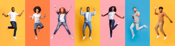 Collage of cheerful jumping multinational people in air on color background, panorama Collage of excited jumping multinational people in air on color background, panorama same person different outfits stock pictures, royalty-free photos & images