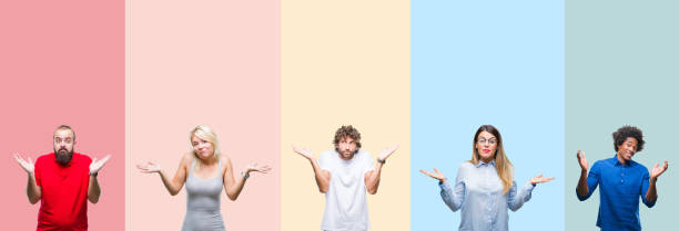 Collage of group of young people over colorful vintage isolated background clueless and confused expression with arms and hands raised. Doubt concept.  ignorance stock pictures, royalty-free photos & images
