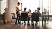 istock Colleagues having meeting in boardroom, businessman giving speech, blurred photo 1325276224