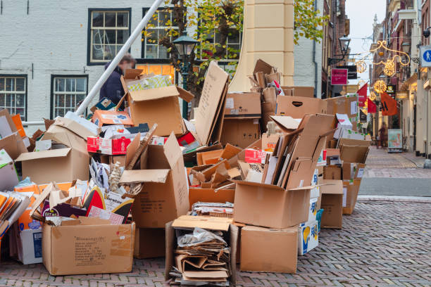 Collected cardboard waste boxes for weekly pickup in the ancient city center of Alkmaar, The Nertherlands stock photo