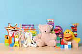 istock Collection of different toys on wooden table 1322274556