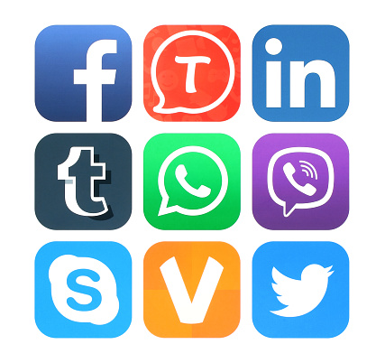 Kiev, Ukraine - February 17, 2016: Collection of popular social networking icons printed on paper: Facebook, Tango, Linkedin, Tumblr, WhatsApp, Viber, Skype, ooVoo and Twitter
