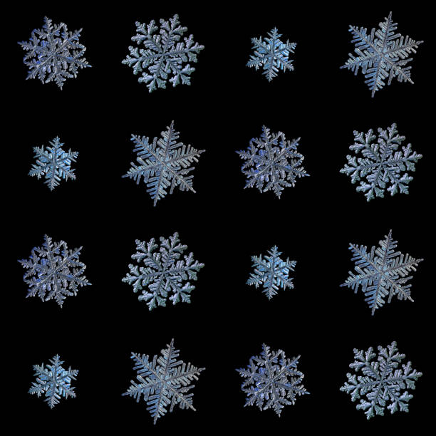 Collection of snowflakes isolated on black background stock photo
