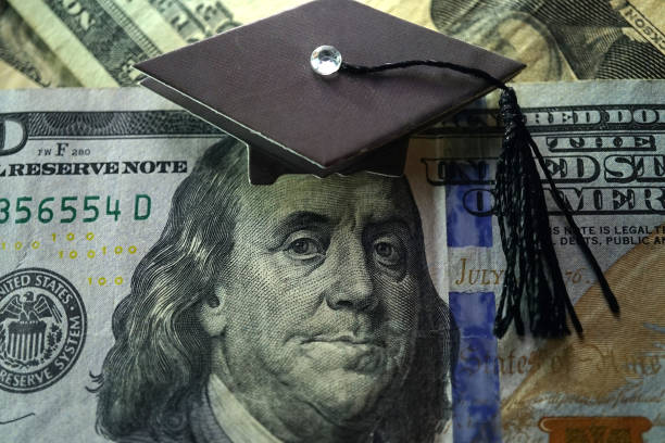 College and money shot of money and college theme student loan stock pictures, royalty-free photos & images