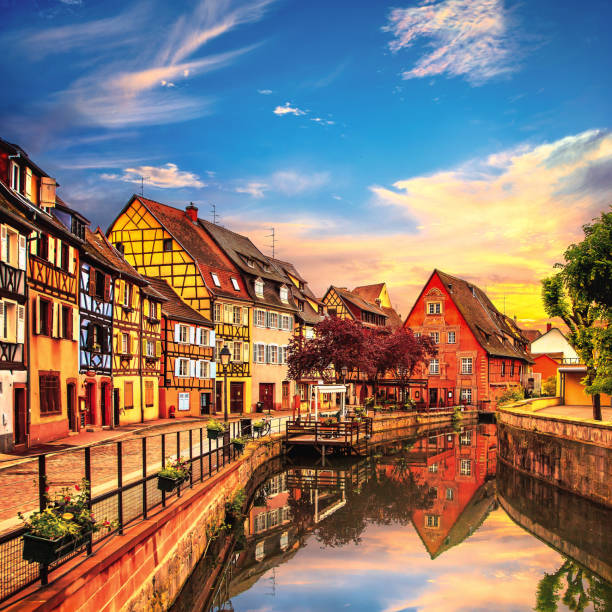 Colmar, Petit Venice, water canal and traditional houses. Alsace, France. Colmar, Petit Venice, water canal and traditional colorful houses. Alsace, France. Long exposure. colmar stock pictures, royalty-free photos & images