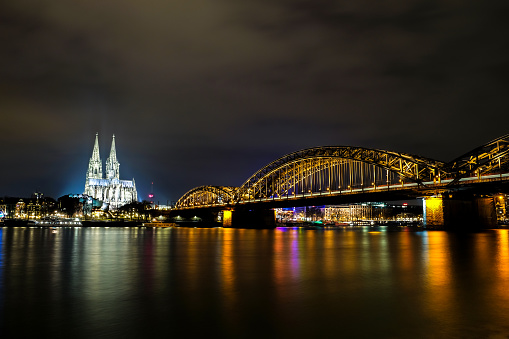 Cologne Cathedral and Hohenzollern Bridge at night in Cologne, Germany