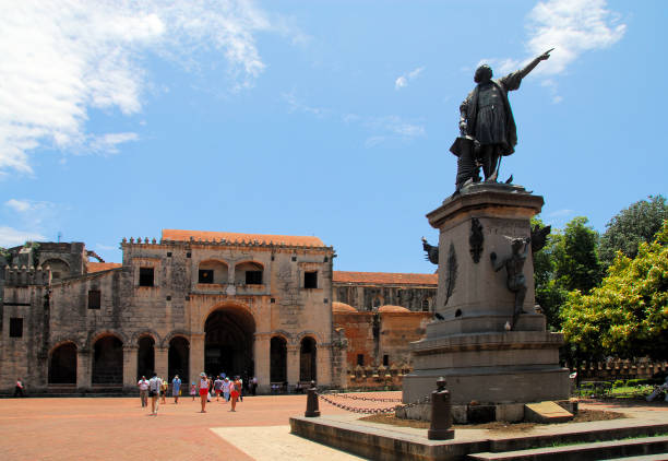 Colon Park - Statue of Christopher Columbus and Cathedral of Santa María la Menor, Santo Domingo, Dominican Republic stock photo