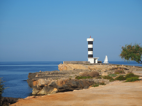 Colonia Sant Jordi, Mallorca, Spain. The lighthouse and the rocks around the village in the morning