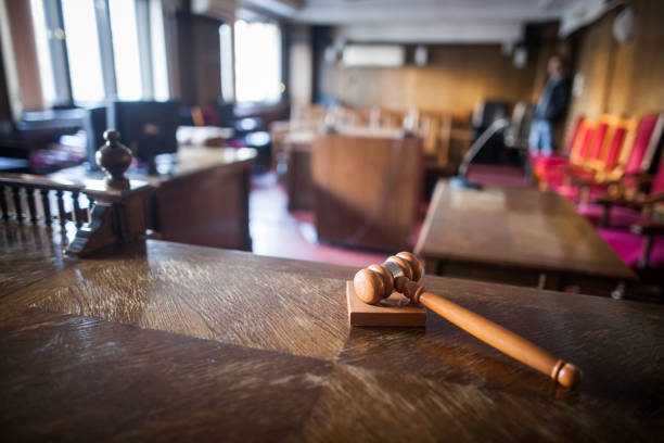 Color image of a hammer in a courtroom. stock photo