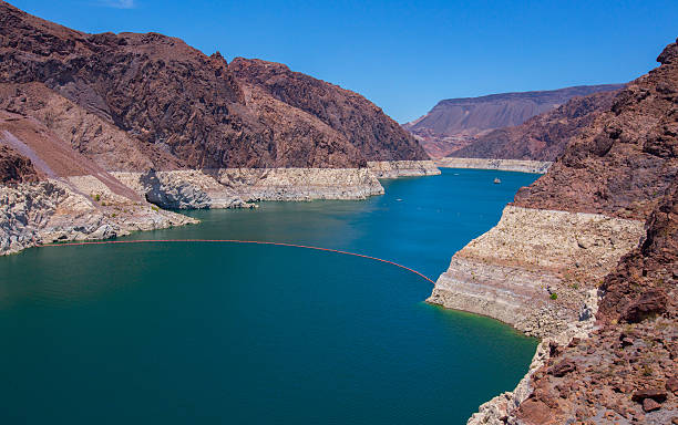 Colorado River The Colorado River held back by the Hoover Dam near Las Vegas in the United States. colorado river stock pictures, royalty-free photos & images