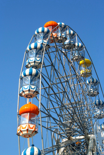 Colored Ferris wheel with blue sky background