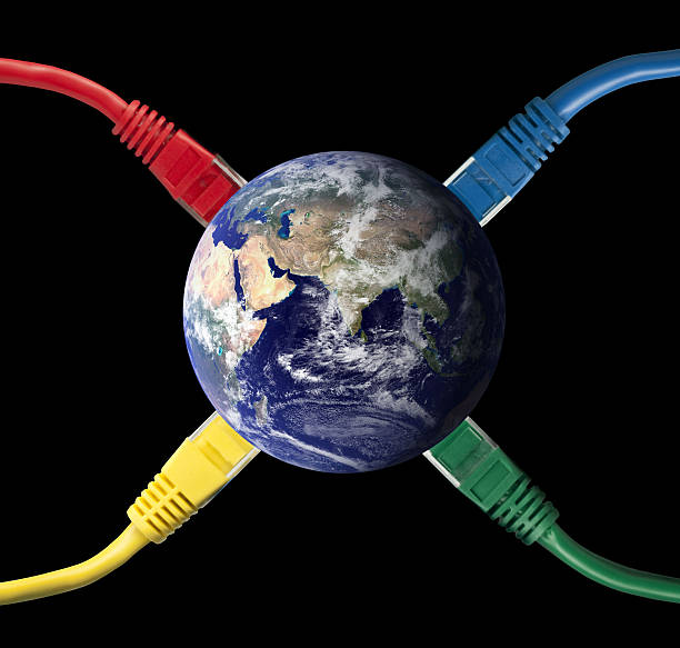 Colored Network Cables connected to the Earth Globe stock photo