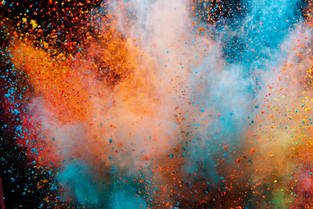 Colored powder explosion on black background. Colored powder explosion on black background. Freeze motion. holi photos stock pictures, royalty-free photos & images
