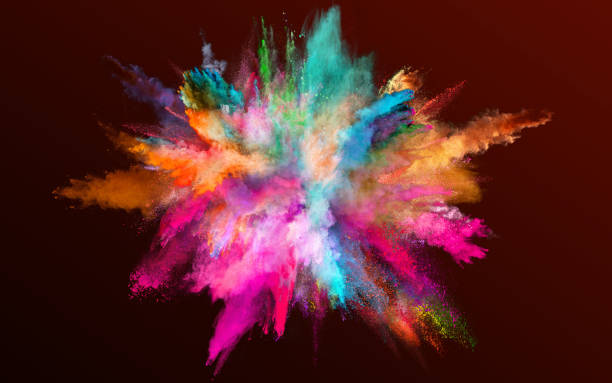 Colored powder explosion on gradient dark background. stock photo