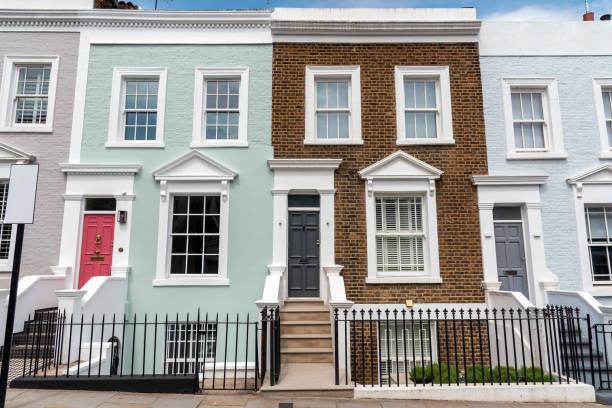 Colored row houses Colored row houses seen in Notting Hill, London brownstone stock pictures, royalty-free photos & images