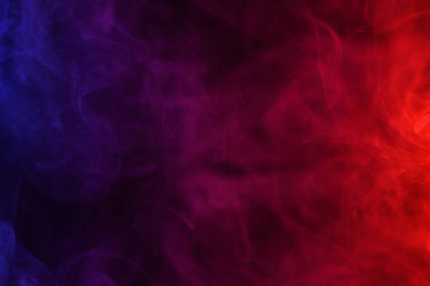 colored smoke flowing dark abstract background - abstract red imagens e fotografias de stock
