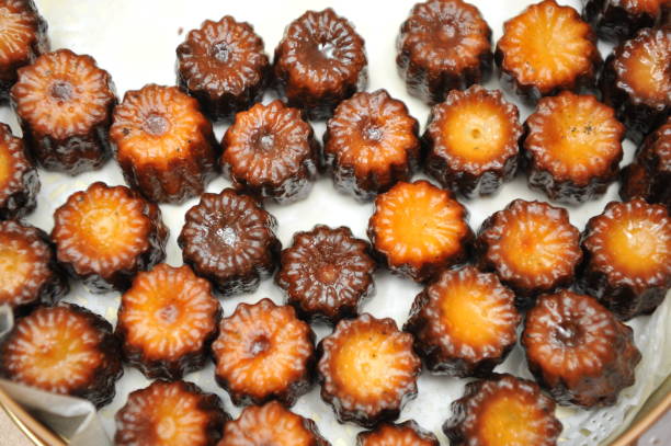 Colorful and delicious French dessert - Canelé stock photo