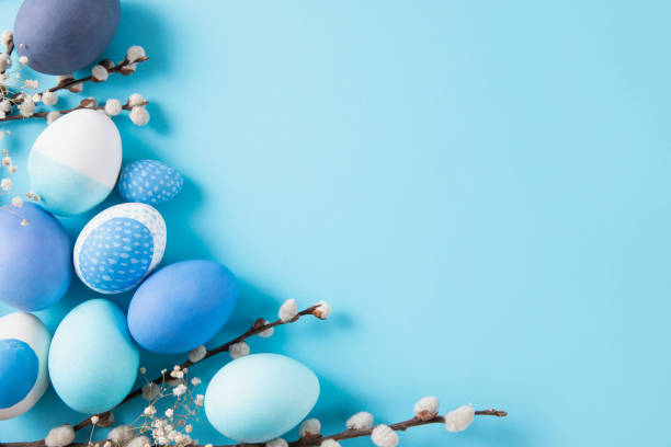 Colorful dyed easter eggs on blue background.