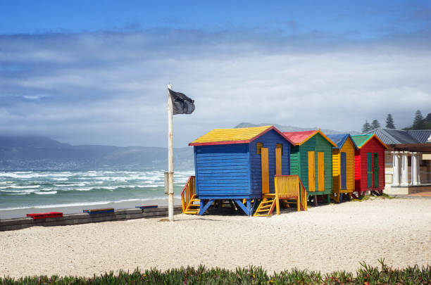 Colorful bathing huts at Muizenberg Beach close to Cape Town in South Africa stock photo