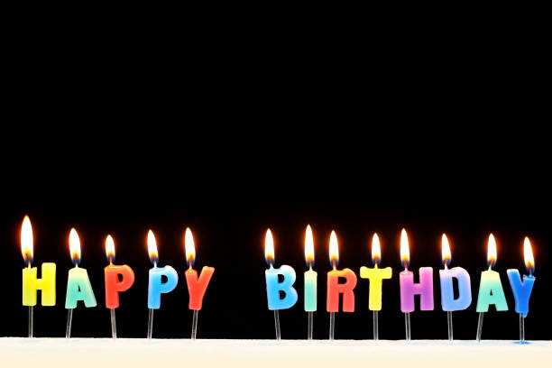 Colorful birthday candles on a black background. happy birthday in danish stock pictures, royalty-free photos & images
