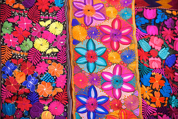 Backgrounds of Textile, colorful Blankets full of flowers. All hand crafted. Found in many cities of Mexico. Culture and tradition specially on independence and 5 de mayo celebrations holidays.