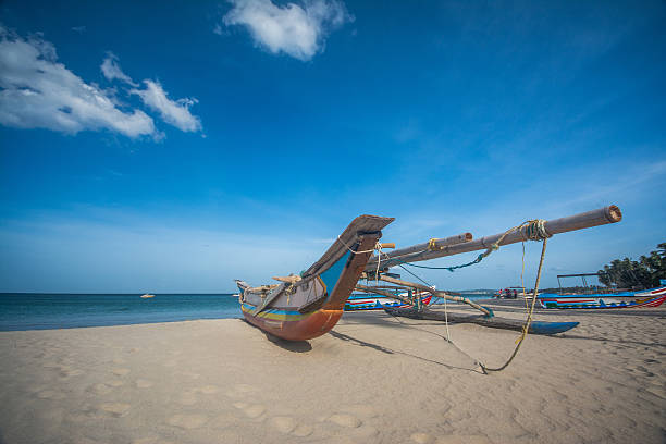 Colorful boat at Trincomalee beach in Sri Lanka stock photo