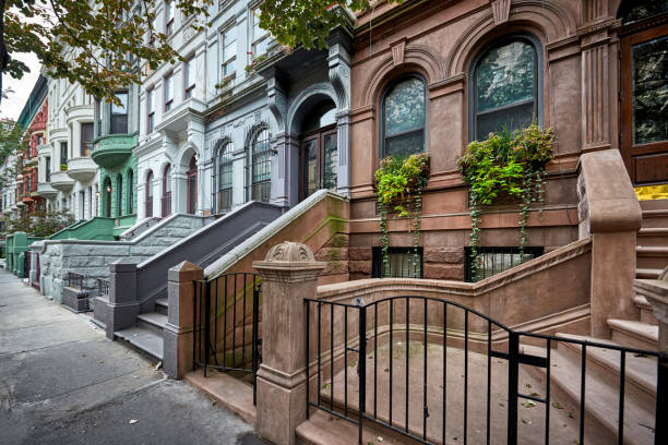 colorful brownstones a row of colorful brownstone buidlings brownstone stock pictures, royalty-free photos & images