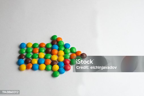 istock Colorful chocolate candies on the white background 1143860312