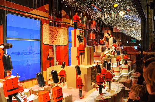 Colorful Christmas decoration in the windows of Printemps department store.