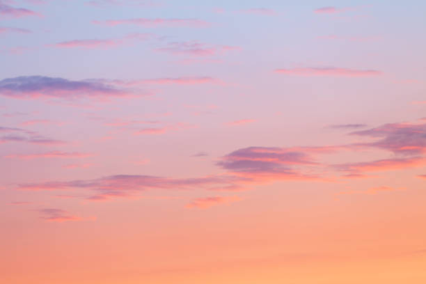 Colorful clouds on dramatic sunset sky stock photo