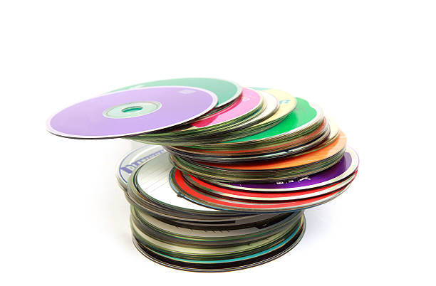 colorful disks a stack of colorful CD's or DVD's. isolated on white. clipping paths dvd stock pictures, royalty-free photos & images