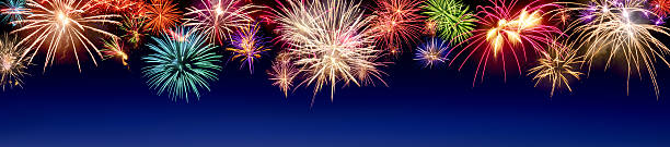 Colorful fireworks display on blue stock photo