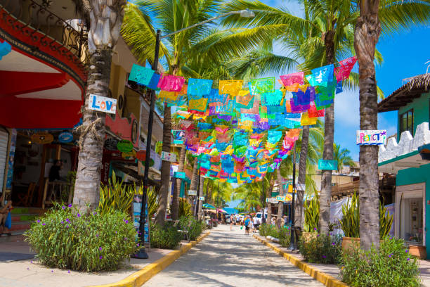 Colorful flags over street in village of Sayulita, Mexico stock photo