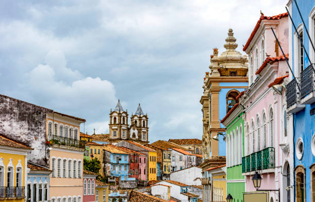 Colorful historical colonial houses facades and church towers in baroque and colonial style Colorful historical colonial houses facades and antique church towers in baroque and colonial style in the famous Pelourinho district of Salvador, Bahia pelourinho stock pictures, royalty-free photos & images