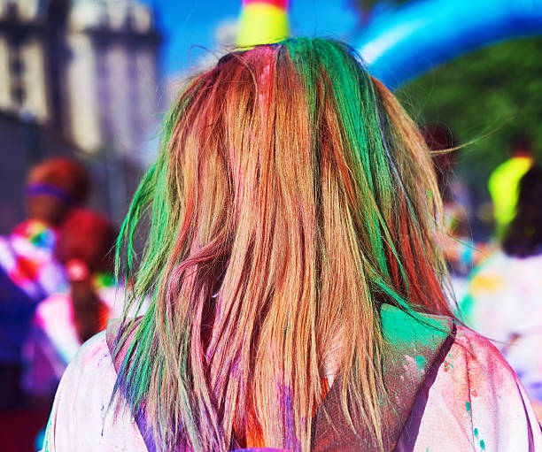 colorful holi powder in her hair - walk and talk bildbanksfoton och bilder