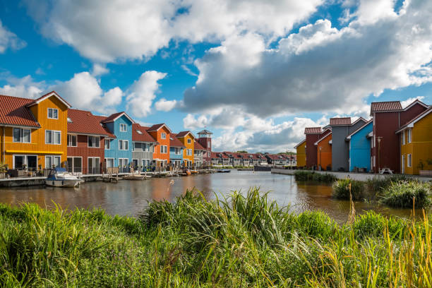 Colorful houses at the harbor Colorful houses at the harbor / Reitdiephaven in Groningen groningen city stock pictures, royalty-free photos & images