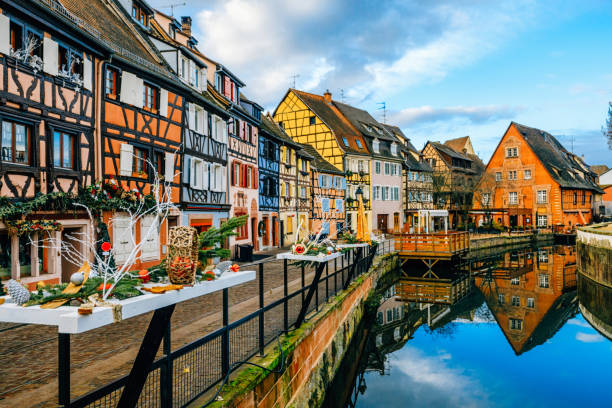 Colorful Houses in Petit Venice, Colmar, France Water canal and traditional colored houses reflected in river Lauch at Noel time in Little Venise Colmar Haut-Rhin department Alsace France Europe alsace stock pictures, royalty-free photos & images