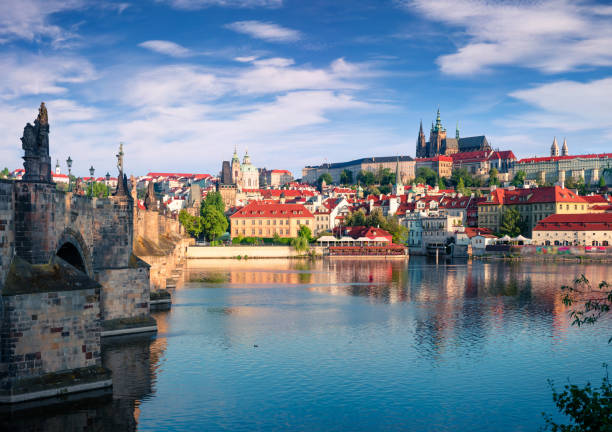Colorful morning view of Charles Bridge, Prague Castle and St. Vitus cathedral on Vltava river Colorful morning view of Charles Bridge, Prague Castle and St. Vitus cathedral on Vltava river. Sunny spring scene in Prague, Czech Republic, Europe. Artistic style post processed photo. hradcany castle stock pictures, royalty-free photos & images