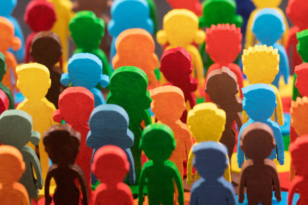 Colorful painted group of people figures stock photo