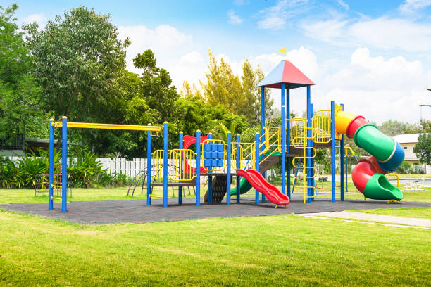 Colorful playground on yard in the park. stock photo