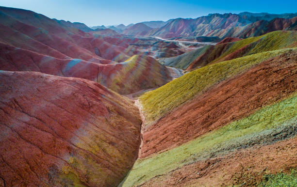 Colorful rainbow mountain chains acptured by a drone Aerial view on the colorful rainbow mountains of Zhangye danxia landform geological park in Gansu province, China, May 2017 danxia landform stock pictures, royalty-free photos & images