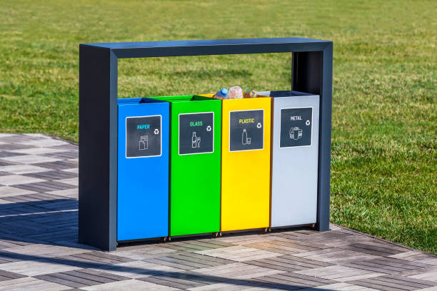 Colorful recycle bins in the park stock photo