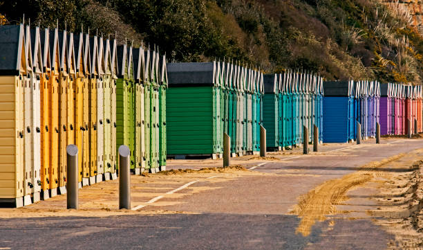 Colorful Row of Beach Huts stock photo
