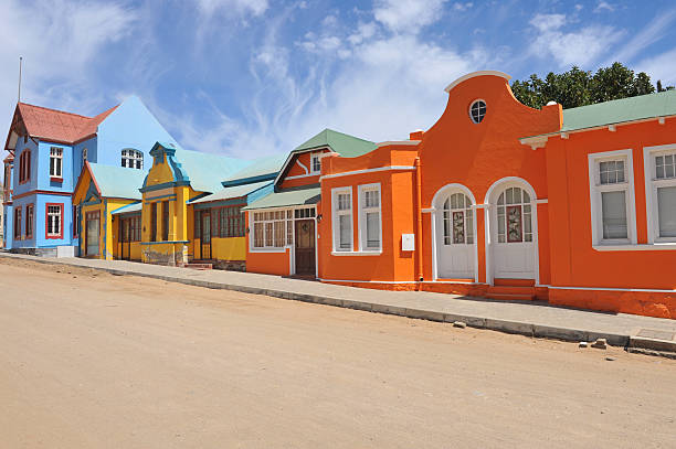 Colorful row orange,blue,yellow houses in Luderitz, Namibia stock photo