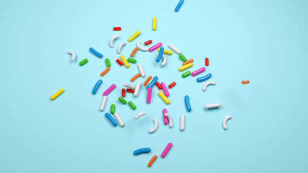 Colorful sprinkles on a blue background, top view isolated 3d Illustration 3d rendering stock photo
