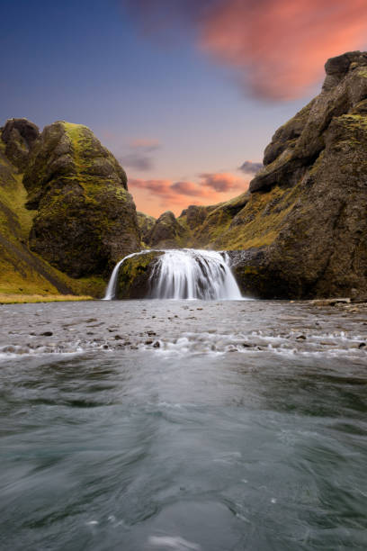 Colorful sunset at a waterfall in Iceland Amazing Sunset in South Iceland dettifoss waterfall stock pictures, royalty-free photos & images