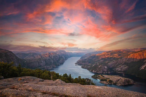 Colorful sunset of the Lysefjord in Norway. View from the Preikestolen stock photo