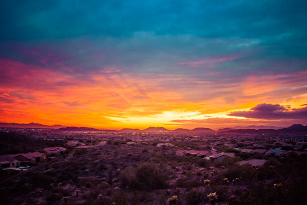 Colorful Sunset over a Desert Community stock photo