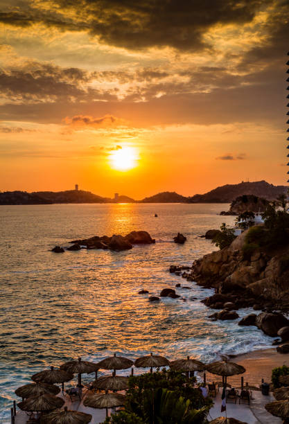 Colorful sunset over Acapulco bay.CR2 stock photo